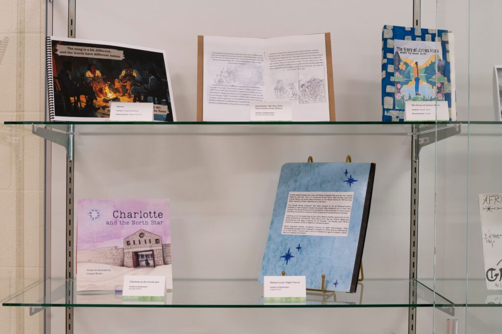 Handmade children's books in a glass case