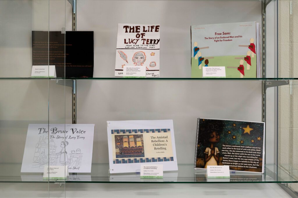Handmade children's books in a glass case